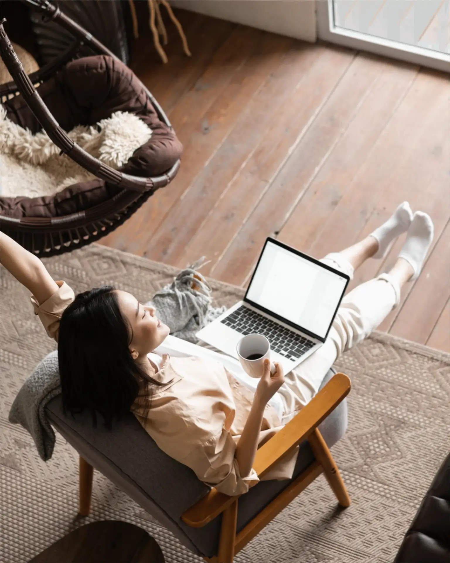 Happy woman browsing laptop